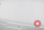 Image of strafing parked truck and stationary vehicles European Theater, 1944, second 11 stock footage video 65675047712