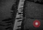 Image of strafing parked truck and stationary vehicles European Theater, 1944, second 16 stock footage video 65675047712
