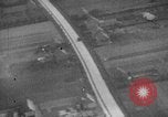 Image of strafing parked truck and stationary vehicles European Theater, 1944, second 32 stock footage video 65675047712