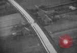 Image of strafing parked truck and stationary vehicles European Theater, 1944, second 33 stock footage video 65675047712