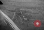 Image of strafing parked truck and stationary vehicles European Theater, 1944, second 36 stock footage video 65675047712