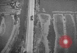 Image of strafing parked truck and stationary vehicles European Theater, 1944, second 38 stock footage video 65675047712