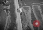 Image of strafing parked truck and stationary vehicles European Theater, 1944, second 39 stock footage video 65675047712