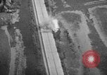 Image of strafing parked truck and stationary vehicles European Theater, 1944, second 40 stock footage video 65675047712
