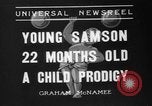 Image of boy on sandy beach United States USA, 1936, second 1 stock footage video 65675047809