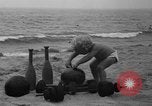 Image of boy on sandy beach United States USA, 1936, second 11 stock footage video 65675047809