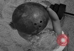 Image of boy on sandy beach United States USA, 1936, second 15 stock footage video 65675047809