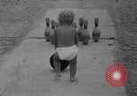 Image of boy on sandy beach United States USA, 1936, second 18 stock footage video 65675047809