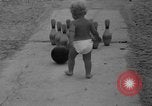 Image of boy on sandy beach United States USA, 1936, second 19 stock footage video 65675047809