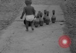 Image of boy on sandy beach United States USA, 1936, second 20 stock footage video 65675047809