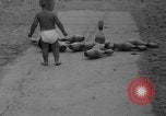 Image of boy on sandy beach United States USA, 1936, second 21 stock footage video 65675047809