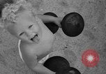 Image of boy on sandy beach United States USA, 1936, second 43 stock footage video 65675047809