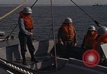 Standbild United States Marines hinabsteigen Gepäcknetzen Okinawa Japan, 1961, aus Sekunde 18 historischem Filmmaterial Videoclip 65675047857