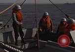 Standbild United States Marines hinabsteigen Gepäcknetzen Okinawa Japan, 1961, aus Sekunde 19 historischem Filmmaterial Videoclip 65675047857