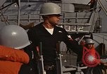 Standbild United States Marines hinabsteigen Gepäcknetzen Okinawa Japan, 1961, aus Sekunde 28 historischem Filmmaterial Videoclip 65675047857