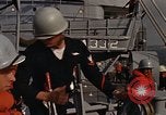 Standbild United States Marines hinabsteigen Gepäcknetzen Okinawa Japan, 1961, aus Sekunde 35 historischem Filmmaterial Videoclip 65675047857