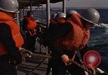 Standbild United States Marines hinabsteigen Gepäcknetzen Okinawa Japan, 1961, aus Sekunde 51 historischem Filmmaterial Videoclip 65675047857