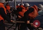 Standbild United States Marines hinabsteigen Gepäcknetzen Okinawa Japan, 1961, aus Sekunde 53 historischem Filmmaterial Videoclip 65675047857