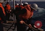 Standbild United States Marines hinabsteigen Gepäcknetzen Okinawa Japan, 1961, aus Sekunde 54 historischem Filmmaterial Videoclip 65675047857
