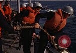 Standbild United States Marines hinabsteigen Gepäcknetzen Okinawa Japan, 1961, aus Sekunde 55 historischem Filmmaterial Videoclip 65675047857