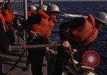 Standbild United States Marines hinabsteigen Gepäcknetzen Okinawa Japan, 1961, aus Sekunde 56 historischem Filmmaterial Videoclip 65675047857