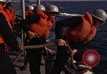 Standbild United States Marines hinabsteigen Gepäcknetzen Okinawa Japan, 1961, aus Sekunde 57 historischem Filmmaterial Videoclip 65675047857
