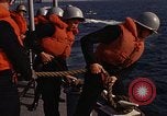 Standbild United States Marines hinabsteigen Gepäcknetzen Okinawa Japan, 1961, aus Sekunde 58 historischem Filmmaterial Videoclip 65675047857