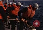 Standbild United States Marines hinabsteigen Gepäcknetzen Okinawa Japan, 1961, aus Sekunde 60 historischem Filmmaterial Videoclip 65675047857