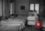 Image of maternity ward Spain, 1942, second 10 stock footage video 65675048270