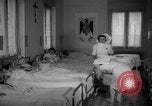 Image of maternity ward Spain, 1942, second 18 stock footage video 65675048270