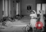 Image of maternity ward Spain, 1942, second 22 stock footage video 65675048270