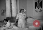 Image of maternity ward Spain, 1942, second 44 stock footage video 65675048270