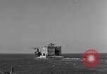 Image of concrete barge Portsmouth England United Kingdom, 1944, second 10 stock footage video 65675048316