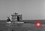 Image of concrete barge Portsmouth England United Kingdom, 1944, second 20 stock footage video 65675048316
