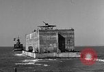 Image of concrete barge Portsmouth England United Kingdom, 1944, second 32 stock footage video 65675048316