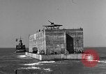Image of concrete barge Portsmouth England United Kingdom, 1944, second 34 stock footage video 65675048316