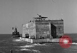 Image of concrete barge Portsmouth England United Kingdom, 1944, second 35 stock footage video 65675048316