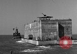 Image of concrete barge Portsmouth England United Kingdom, 1944, second 38 stock footage video 65675048316
