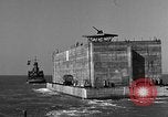 Image of concrete barge Portsmouth England United Kingdom, 1944, second 39 stock footage video 65675048316