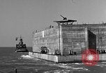 Image of concrete barge Portsmouth England United Kingdom, 1944, second 41 stock footage video 65675048316