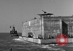 Image of concrete barge Portsmouth England United Kingdom, 1944, second 42 stock footage video 65675048316