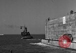 Image of concrete barge Portsmouth England United Kingdom, 1944, second 45 stock footage video 65675048316