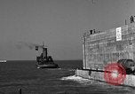 Image of concrete barge Portsmouth England United Kingdom, 1944, second 47 stock footage video 65675048316