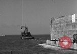 Image of concrete barge Portsmouth England United Kingdom, 1944, second 50 stock footage video 65675048316
