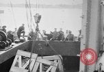 Image of a crane unloading military equipment Bordeaux France, 1918, second 3 stock footage video 65675048400
