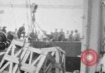 Image of a crane unloading military equipment Bordeaux France, 1918, second 6 stock footage video 65675048400