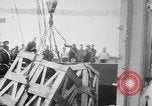 Image of a crane unloading military equipment Bordeaux France, 1918, second 9 stock footage video 65675048400