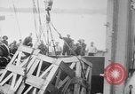 Image of a crane unloading military equipment Bordeaux France, 1918, second 10 stock footage video 65675048400