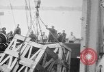 Image of a crane unloading military equipment Bordeaux France, 1918, second 12 stock footage video 65675048400