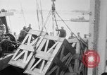 Image of a crane unloading military equipment Bordeaux France, 1918, second 17 stock footage video 65675048400